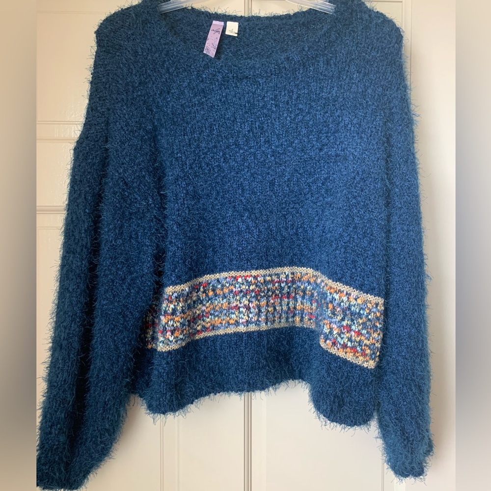 Navy blue long sleeved sweater.